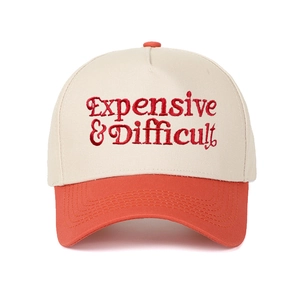 Close-up of red Expensive & Difficult embroidery on a two-tone cotton baseball cap