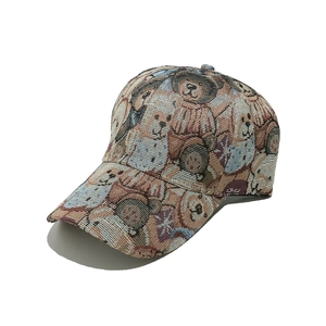 Detail of jacquard fabric baseball cap with teddy bear and British flag patterns