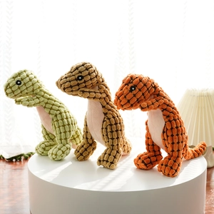 Close-up of colorful plush dinosaur pet toys showing textured corn fleece fabric detail