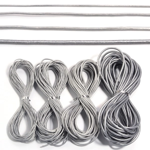 Detail of silver leather cords in four different diameters for DIY jewelry making crafts