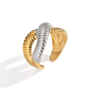 Detail of two-tone croissant ring with twisted texture and 18k gold plated finish