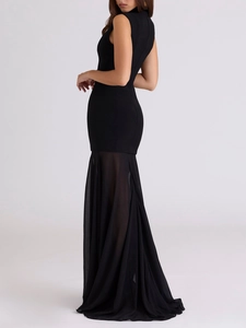 Detail of the elegant mermaid hemline with sheer black mesh stitching on a slim-fit dress