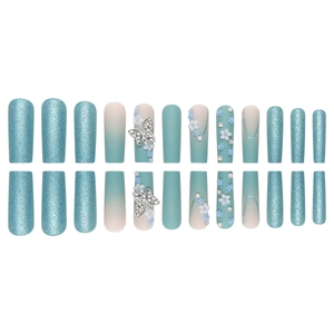 Blue glitter and matte gradient press-on nails with 3D silver bow and floral charms