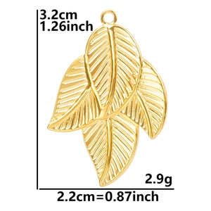 Detail view of 18k gold plated leaf pendant with size markings and vein texture
