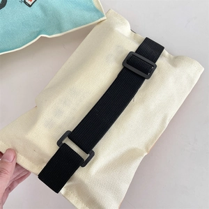 Rear view of canvas car tissue holder featuring black adjustable strap and buckle