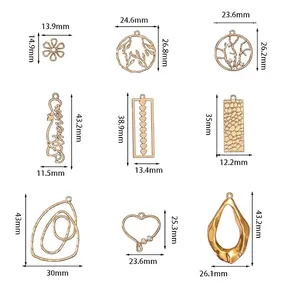 Golden alloy pendants set with assorted flower, heart and tree shapes for DIY jewelry