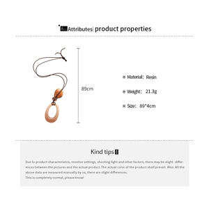 Detailed view of resin geometric pendant necklace showing product dimensions and materials