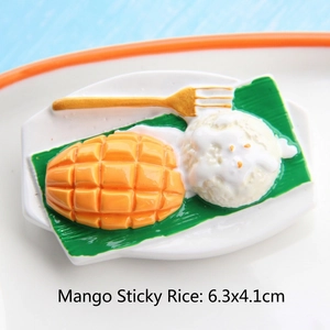 Macro detail of miniature Thai mango sticky rice model on a ceramic plate with size info
