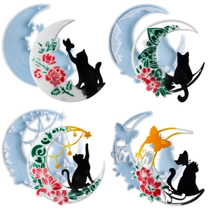 Detail view of crescent moon cat resin molds and finished floral decorative hangers