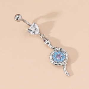 Macro detail of a silver belly ring featuring a snake pendant with colored zircons