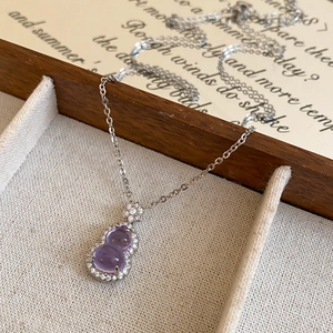 Elegant purple glass gourd pendant necklace with sparkling cubic zirconia on a silver chain