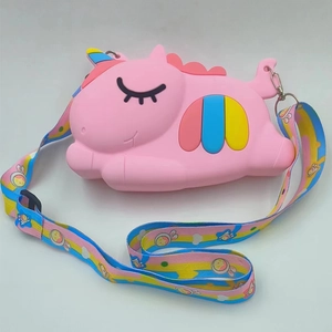 Detailed view of pink unicorn silicone pop bag with rainbow side trim and printed strap