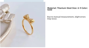 Detail of elegant golden bow titanium steel ring with size and material specifications