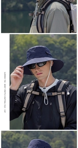 Detail of navy blue wide brim sun hat with adjustable chin strap for hiking