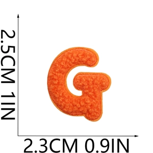Macro detail of orange Chenille letter G patch showing 2.5cm size embroidery texture