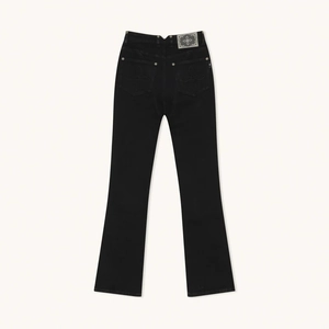 Black high-waisted flared jeans with cross embroidery on back pockets, flat lay view