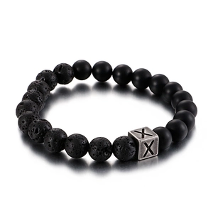 Beaded bracelet with black lava rock, matte agate beads and silver metal letter X charm