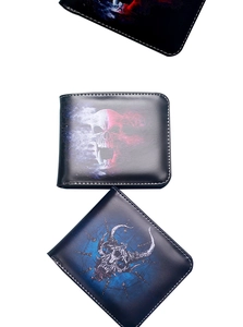 Detailed view of three vintage skull print wallets in stacked vertical arrangement