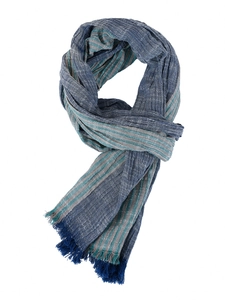 Detail showing navy blue striped cotton linen blend scarf with fringe edges and soft texture