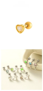 Detail view of heart and star cartilage studs with opal inlay and zircon accents