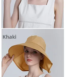 Detail of khaki sun hat featuring wide brim with neck protection and breathable fabric