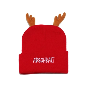 Red knit beanie with festive reindeer antlers and white ARSCHKALT embroidery