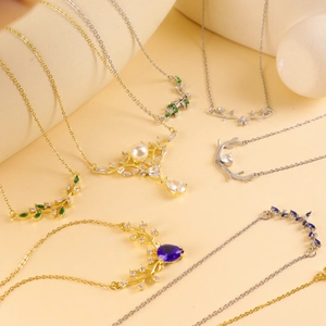Golden and silver deer antler necklaces with pearls and colorful zircon pendants