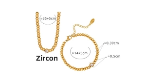 Detail view of 18K gold beaded jewelry set with zircon pendant and size measurements