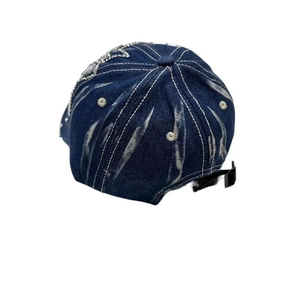 Detail of blue denim baseball cap with rhinestone star chain and adjustable back strap