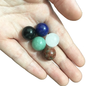 Detailed close-up of five assorted 16mm natural crystal balls for feng shui decor