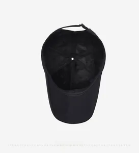 Detail view of the black baseball cap interior showing seams and adjustable strap