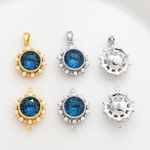 Macro detail of 14k gold plated blue gemstone pendants with pearl borders in a grid