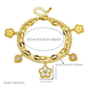 Double-layered gold chain bracelet with white shell flower and crystal heart charms