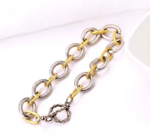 Two-tone textured stainless steel chain bracelet with T-bar toggle closure