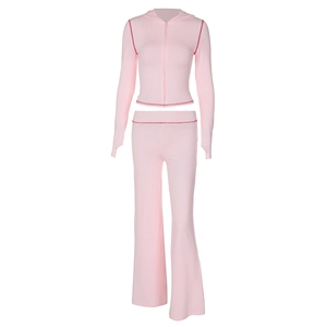 Flat lay view of pink leopard print hooded zip-up jacket and matching flared trousers set