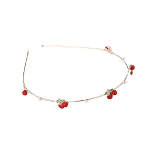 Close-up of slim gold metal headband with red cherry charms and white bead accents
