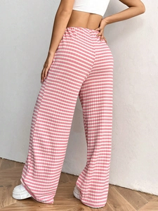Close-up of pink and white striped ribbed fabric on high-waisted wide-leg cotton pants