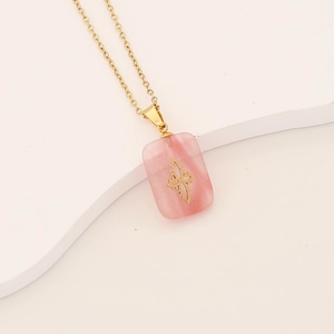 Long pink natural stone pendant with gold pattern on a fine stainless steel chain