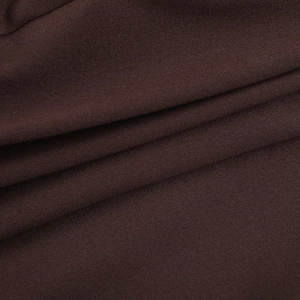 Detailed view of high-quality dark brown knitted fabric texture and soft drape of the jumpsuit