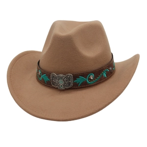Detail of western cowboy hat with turquoise vine embroidery and silver butterfly buckle