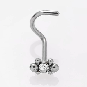 Macro detail of stainless steel nose stud featuring a zircon flower cluster on white background