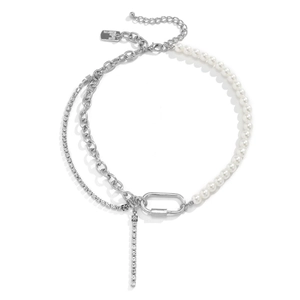Detail of layered necklace featuring asymmetric faux pearls, silver Cuban chain and rhinestones