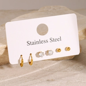 Three-pair gold stainless steel earring set featuring zircon studs and minimalist hoops
