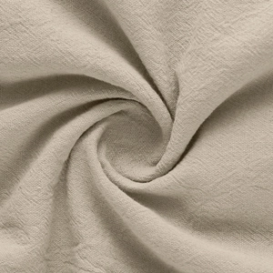Close-up of beige linen fabric texture with a detailed woven pattern and natural fiber feel