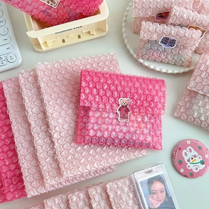 Close-up of pink heart-shaped bubble mailers for protective gift and stationery packaging