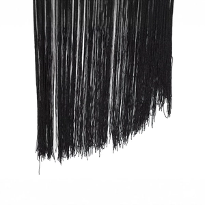 Elegant black fringe dress detailing featuring dense silk tassels and cascading texture