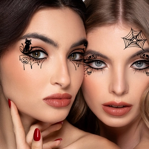 Close-up of Halloween eye temporary tattoos with spider web and skull patterns for parties