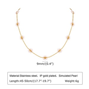 Detail of emerald flower necklace featuring IP gold plated steel and faux pearls