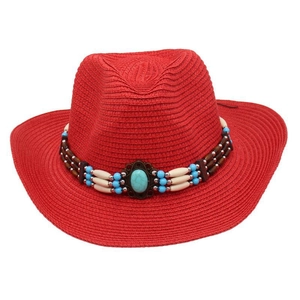 Close-up of red straw cowboy hat featuring an ethnic beaded band with a turquoise stone.