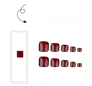 Detail of glossy dark red cat-eye press-on toenails in 10-piece set arrangement